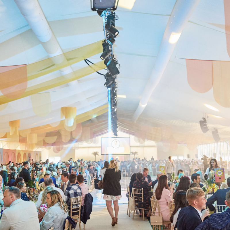 A decorated marquee with an event taking place